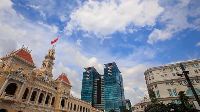 Wind Shakes Vietnamese Flag on Old Building by Skyscraper