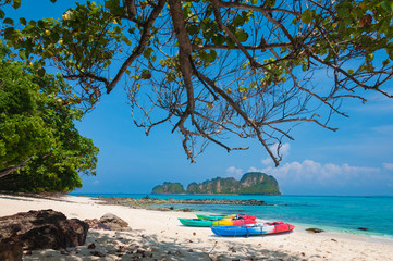 Colorful kayak on sandy beach by crystal blue sea in Phuket, Tha
