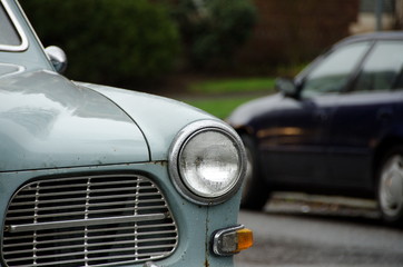 Obraz na płótnie Canvas Classic and modern cars parked under rain on Queen Ann hill, Sea
