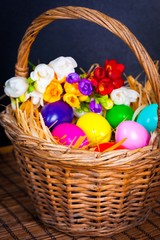 Easter eggs and freesia in basket