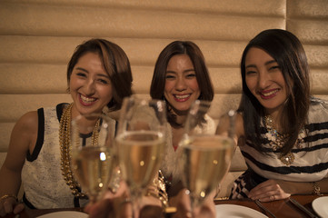 Young women toast with champagne