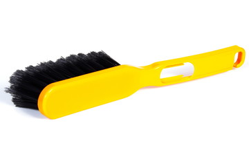 New orange broom for cleaning on white background