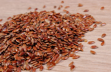 Heap of linseed on wooden background