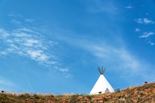 White teepee with a beautiful blue sky near Beulah, Wyoming