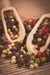 Vintage photo, Fresh colored pepper with spoon on wooden background