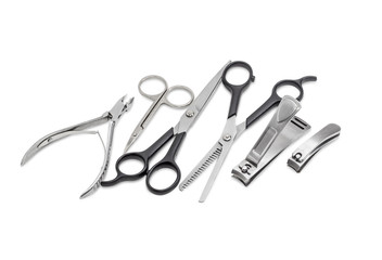 Several different nail clippers, nail scissors and two hairdress