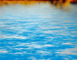 Abstract series of waves on the water surface