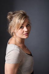 Naklejka premium Cute blond girl shot in studio