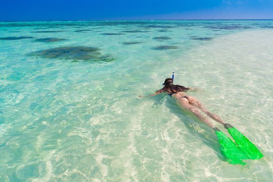 Maldives, women snorkeling