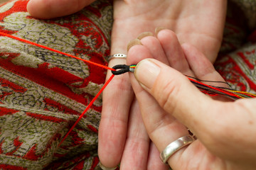 Needlework lessons. Weave bracelets.