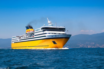 Fototapeta na wymiar Big yellow passenger ferry on the Mediterranean Sea