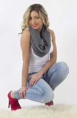 Fototapeta premium Beautiful young woman posing in studio on white background