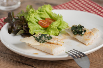 Clean food, Fish fillet with basil and garlic sauce.