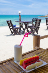 Breakfast with tropical fruit and juice at beach resort
