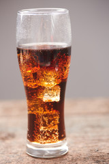 whiskey with cola with ice closeup