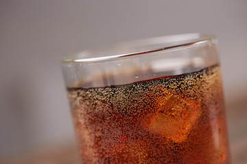 whiskey with cola with ice closeup