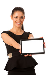 Businesswoman holding tablet computer and showing blank monitor