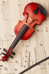 Obraz na płótnie Canvas violin on of notes background