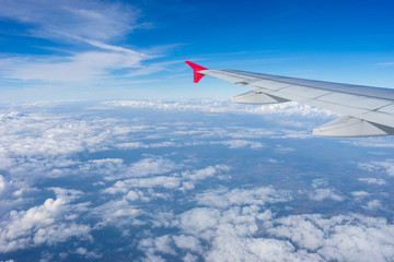 aircraft Wing on cloud and blue sky