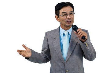 Asian businessman holding microphone 