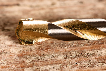 Macro image of Drill bits for concrete on wooden background.
