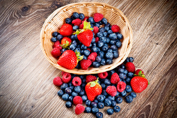 Berries on wooden background