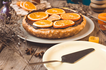 Orange cake on the wooden background