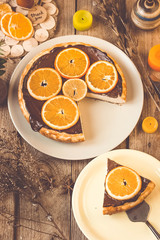 Orange cake on the wooden background