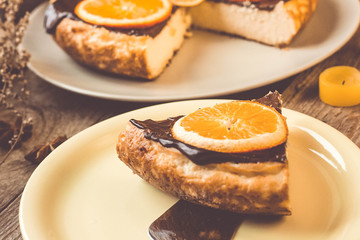 Orange cake on the wooden background