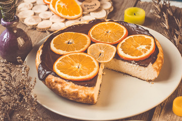 Orange cake on the wooden background