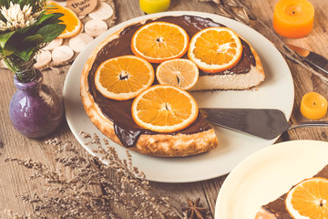 Orange cake on the wooden background