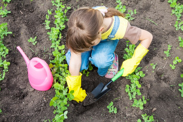 little girl in garden