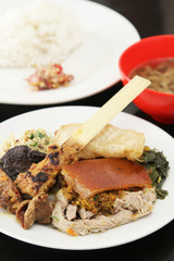 Balinese Babi Guling meal or roasted suckling pig