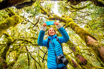 Woman traveling evergreen forest