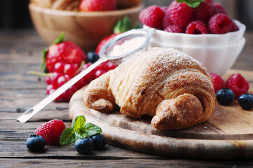 Fresh croissant with mix of berry
