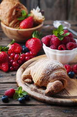 Fresh croissant with mix of berry