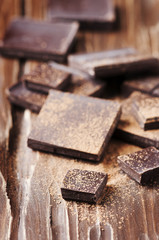 Dark chocolate on the wooden table