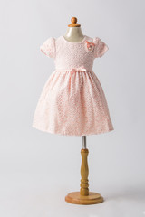 baby pink dress on a mannequin