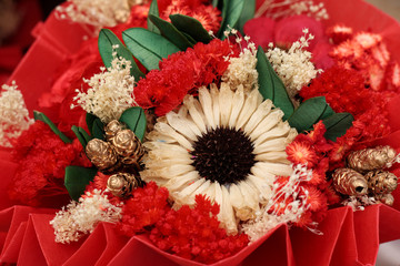 Close up of colorful artificial flowers bouquet.