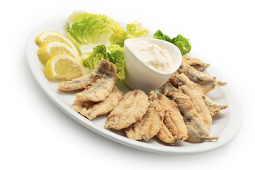 Fried anchovies with salad and mayonnaise