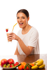 Obraz premium Woman excited of fresh fruit smoothie healthy meal.