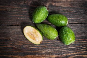 Feijoa on wooden background. Closeup. Top view