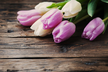 Bouquet of tulips on the wooden table