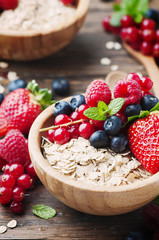 Oats withmix of berry on the wooden table
