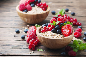 Oats withmix of berry on the wooden table