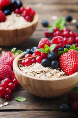 Oats withmix of berry on the wooden table