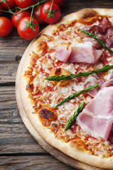 Italian pizza with ham and asparagus