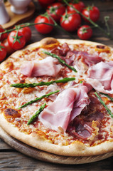 Italian pizza with ham and asparagus