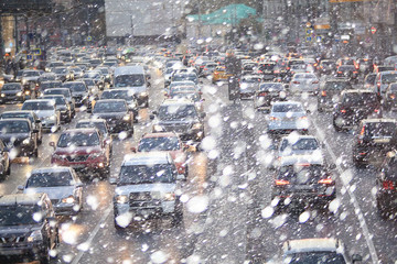 Fototapeta premium Snow in the city night traffic road transport