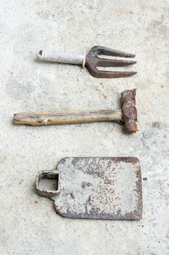 used old tools on cement background